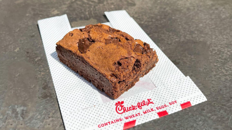 A close up of Chick-fil-A's chocolate brownie on top of a branded wrapper