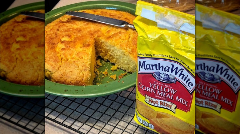 packet of Martha White Yellow corn meal mix next to baked cornbread on metal tray.
