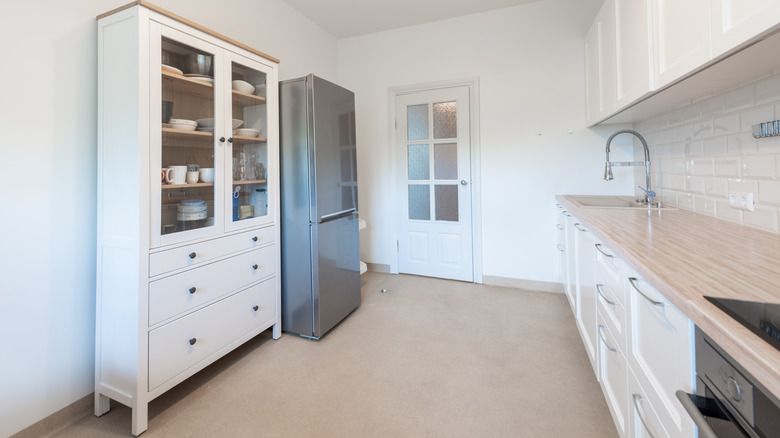 Tall white kitchen cabinet