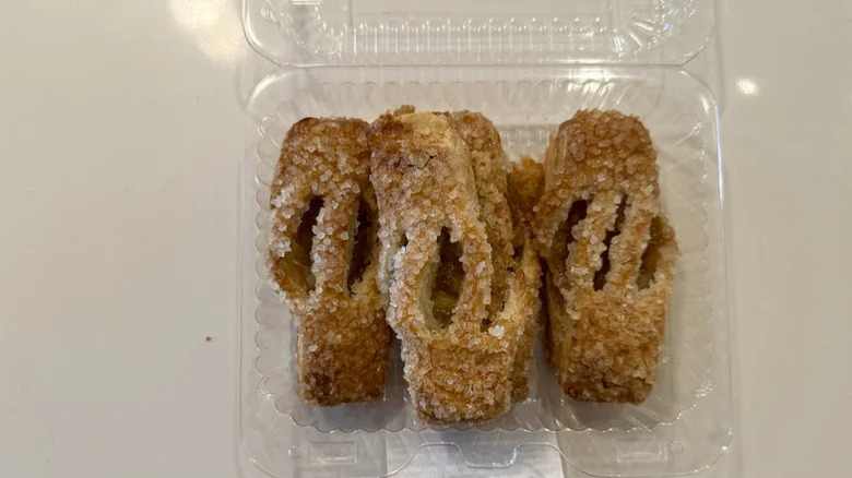 A plastic container filled with mini apple streusels from Publix