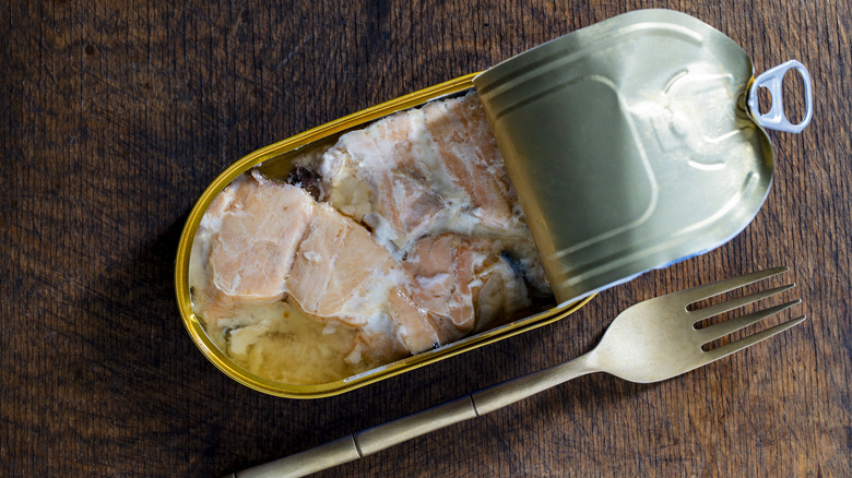 canned salmon opened with a fork