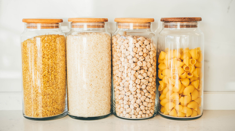 jars of rice, chickpeas and pasta in a row