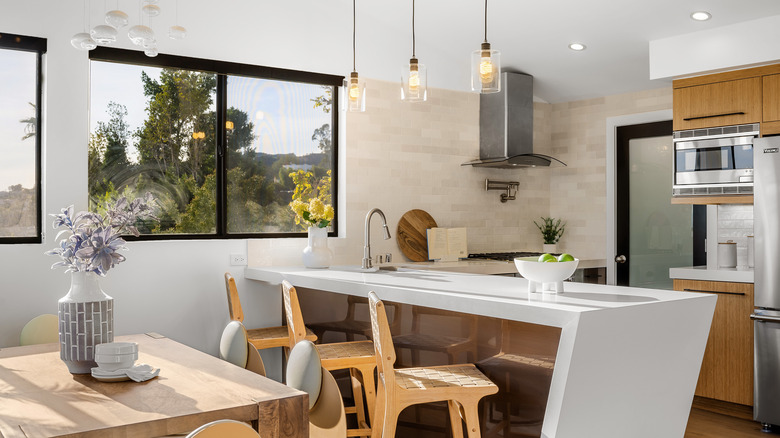 Modern kitchen with stainless steel vent hood