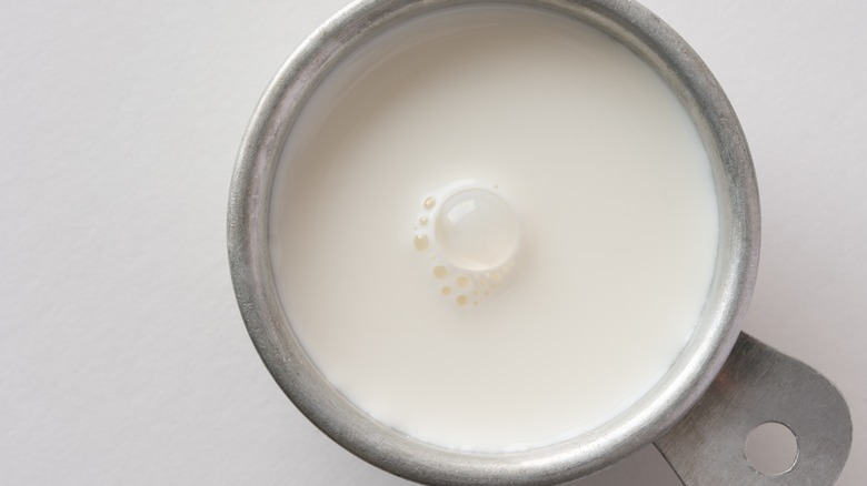 heavy cream in measuring cup 