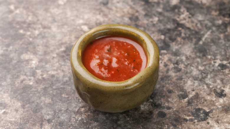 A small bowl of chili sauce