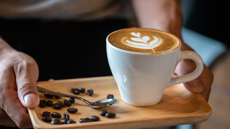 Carrying an espresso beverage on a plate