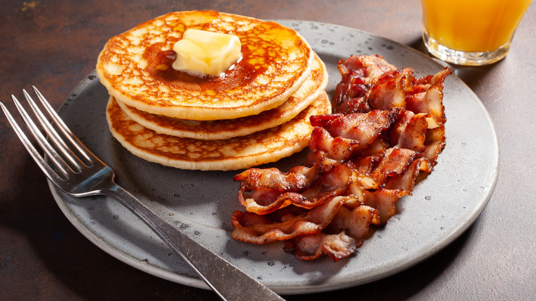 Pancakes and bacon on plate