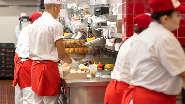 Employees working in an In-N-Out kitchen