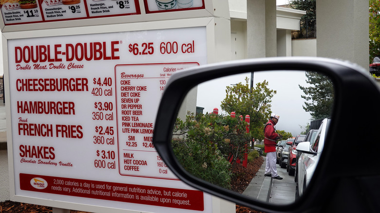 In-N-Out drive thru sign and car mirror