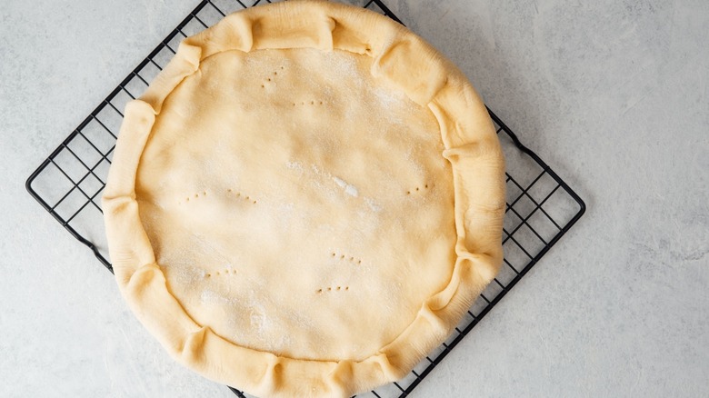 A homemade pie on a wire rack