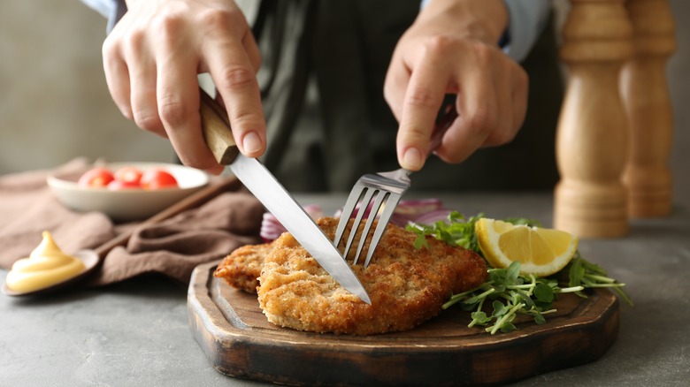 Cutting a chicken cutlet