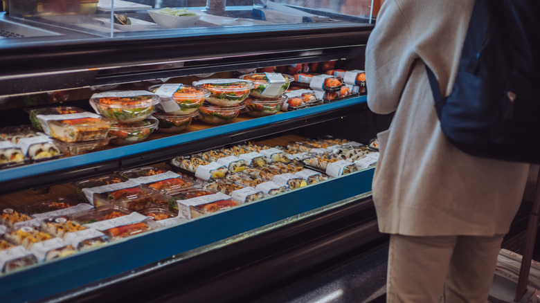 A well-stocked sushi counter at a grocery store