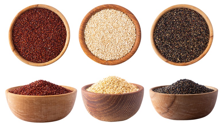 red, white, and black quinoa in bowls