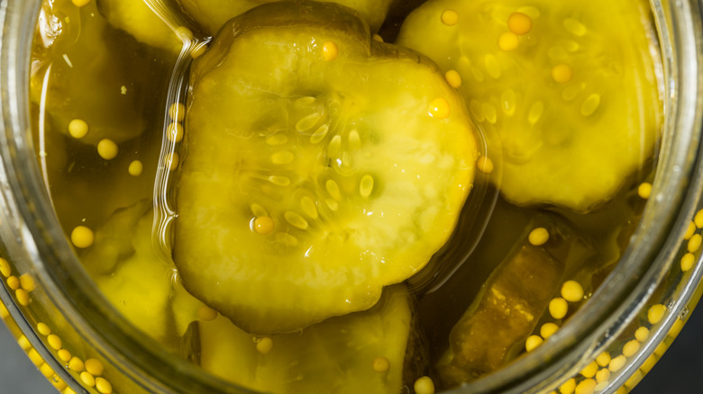 open jar of dill pickle chips