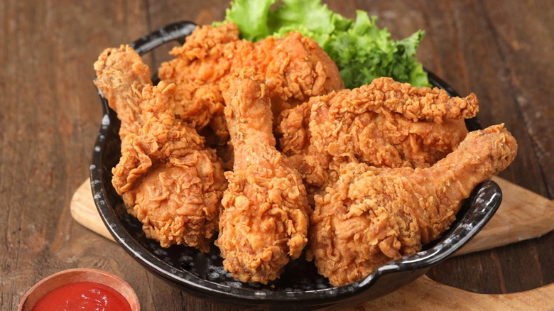 Crispy fried chicken with a side of ketchup.