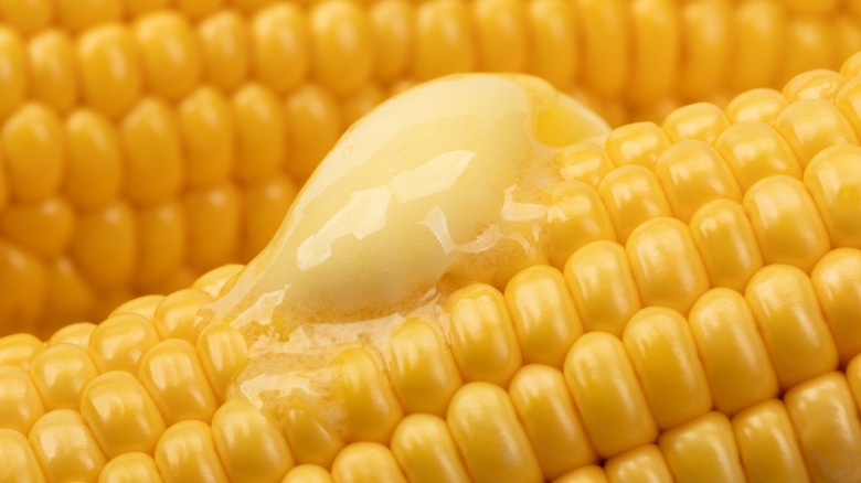 butter melting on hot ears of corn