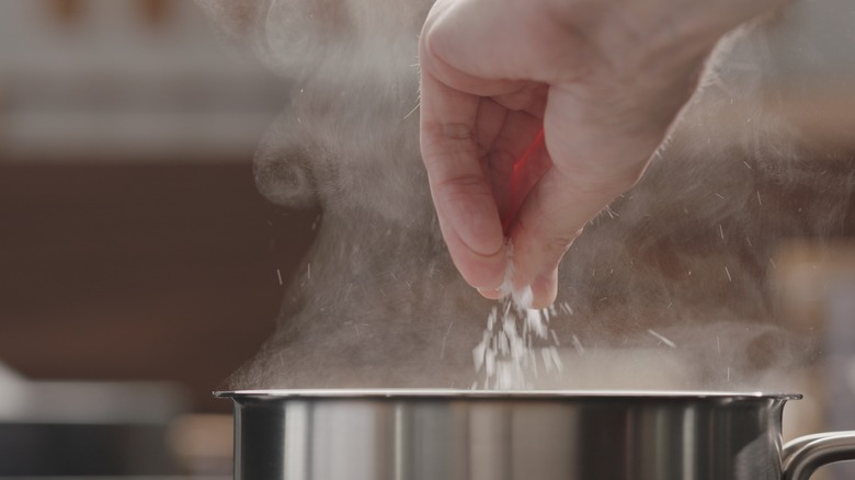 Adding salt to boiling water