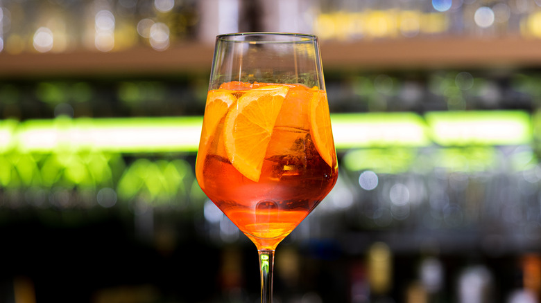 Aperol spritz glass blurry bar