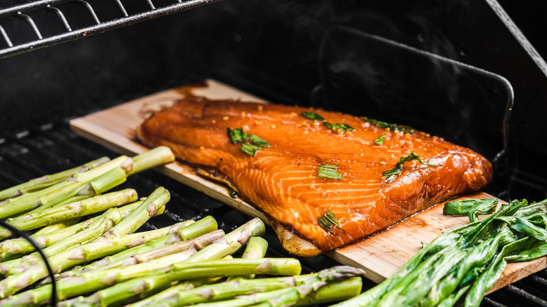 Cedar plank salmon on grill
