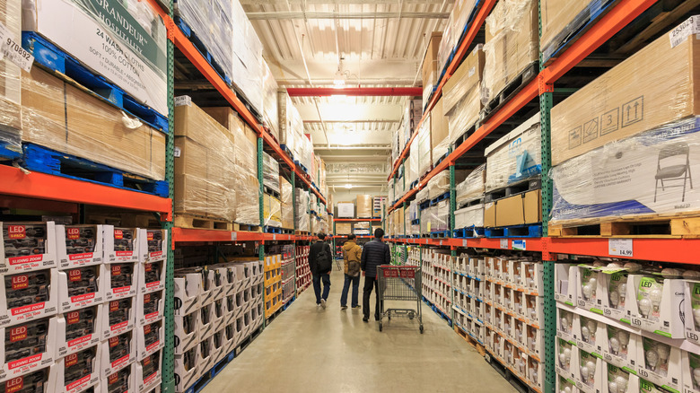 Shoppers walking down an aisle at Costco