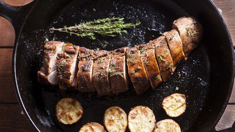 Sliced pork tenderloin in a skillet