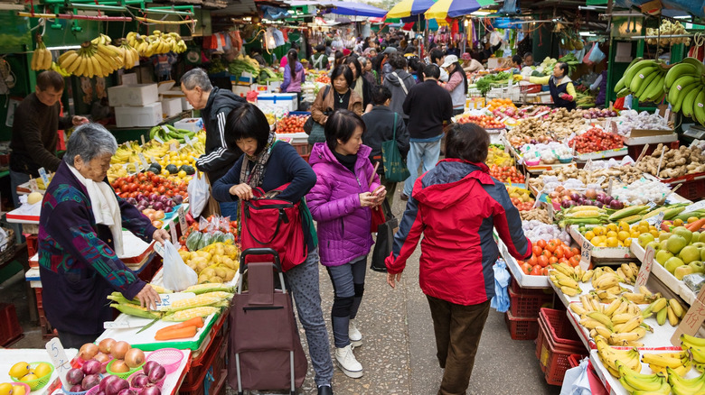 People shopping at a food Market in Hong Kong
