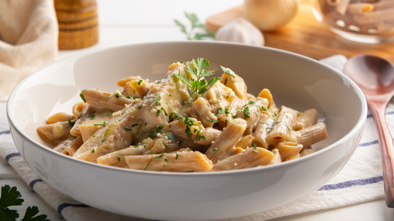 Alfredo chicken pasta in a creamy sauce in a bowl