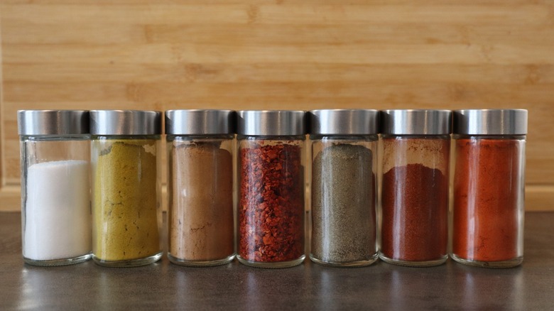 Glass jars of spices lined up
