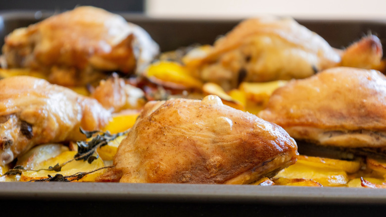 Crispy chicken thighs on a baking sheet