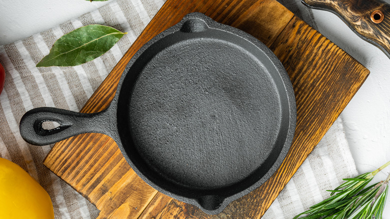 Cast iron pan on a cutting board