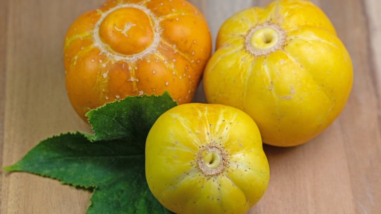 lemon cucumbers on a wooden backdrop