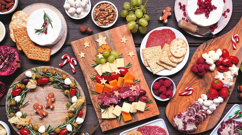 Christmas charcuterie spread with cheese, crackers, cured meats, and berries