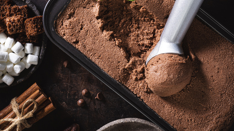 a pan of homemade chocolate ice cream with a scoop
