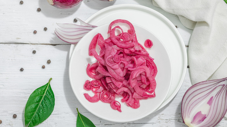 Pickled red onions on a white dish