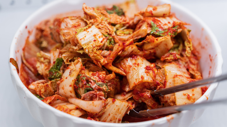 Bowl of kimchi with chopsticks