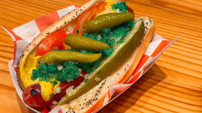 Hot dog with raw tomatoes