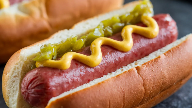 Hot dog topped with green relish