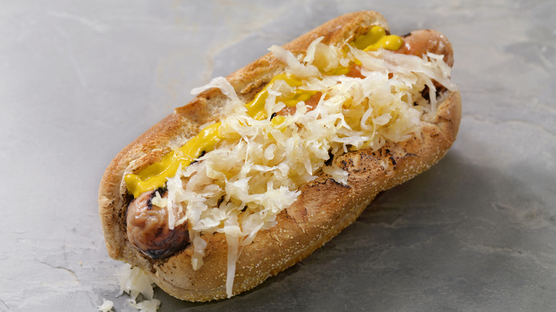 Hot dog with sauerkraut and mustard