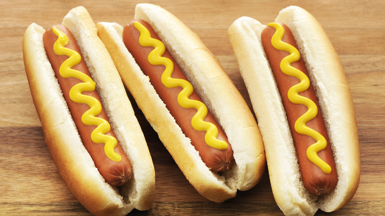 Hot dogs with yellow mustard
