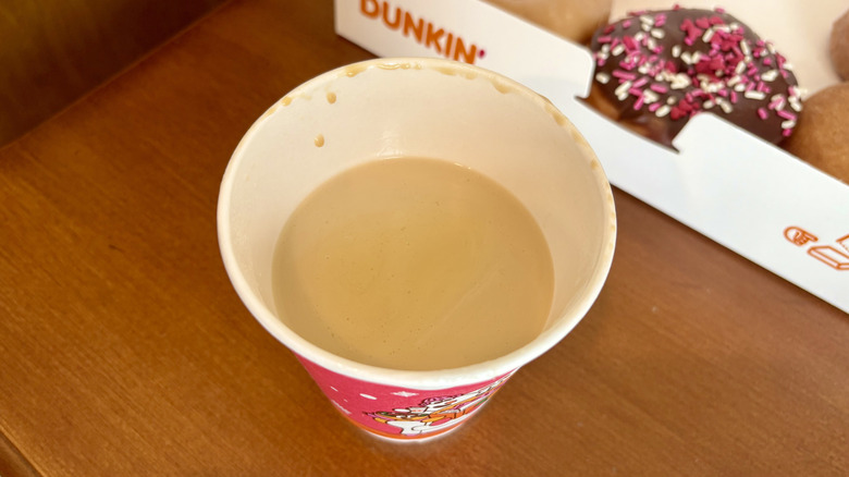 A Caramel Craze Signature Latte from Dunkin' with a Dunkin' box in the background