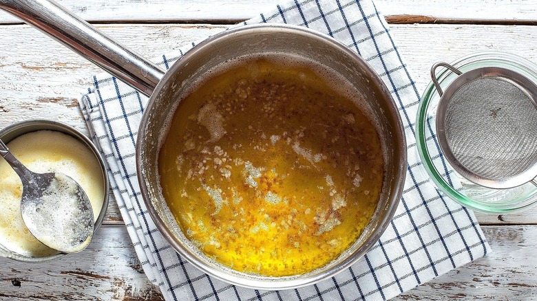 Melted butter in a pot with foam removed