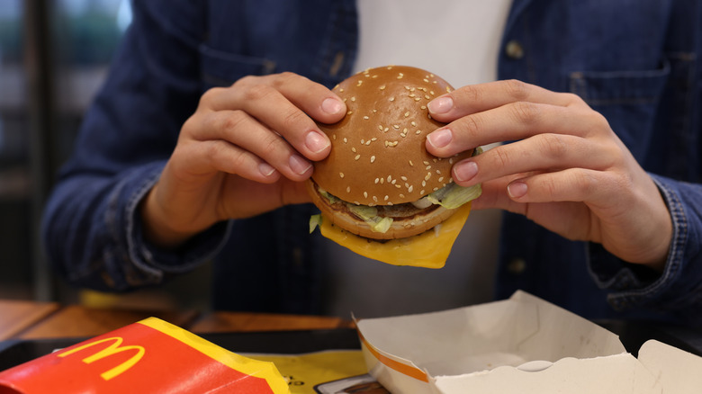 Person eating a McDonald's burger