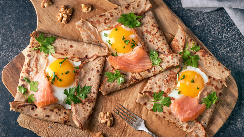 Folded crepes with eggs and salmon