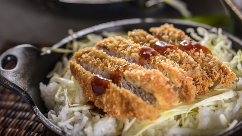 Panko-crumbed pork on noodles