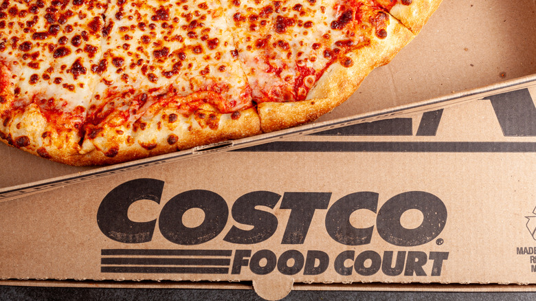 Boxes of fresh Costco cheese pizza.