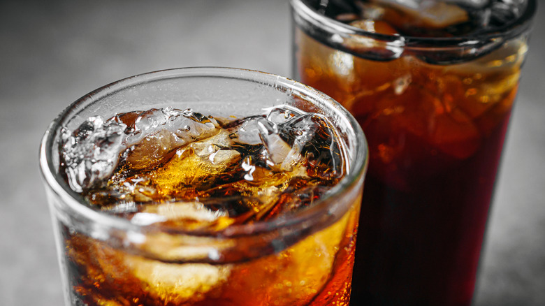 Close up of 2 cold glasses of cola with ice