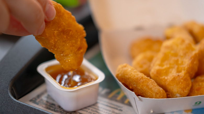 McNugget being dipped in sauce