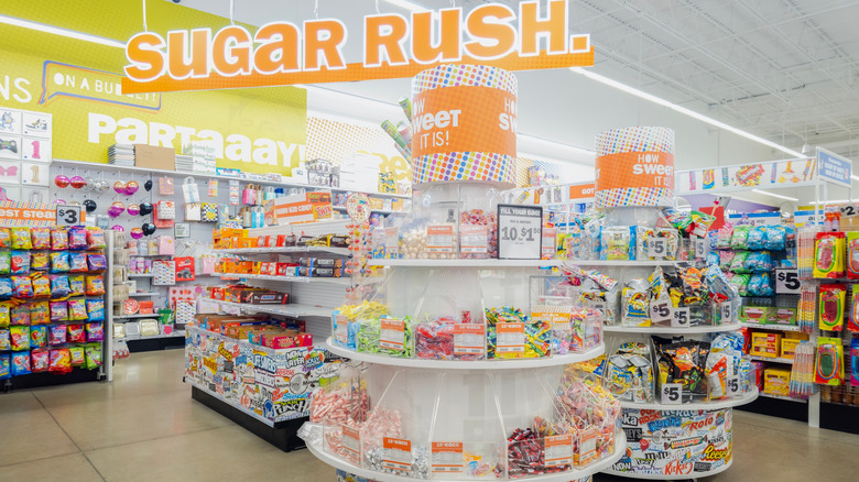 The candy section at Five Below with a sign reading sugar rush.