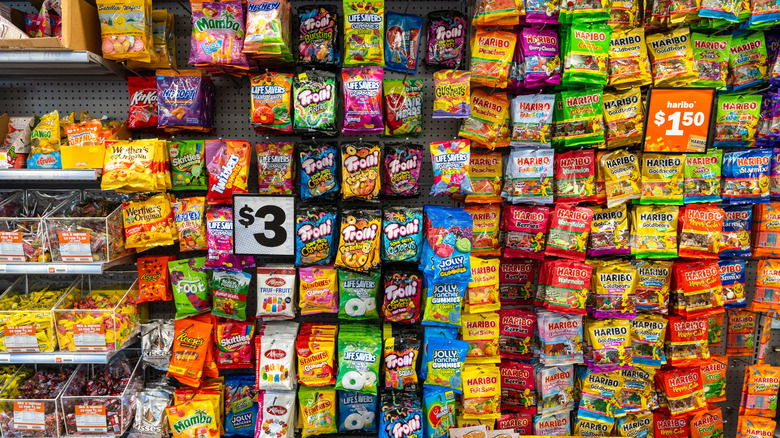 An aisle of candy at a retailer.