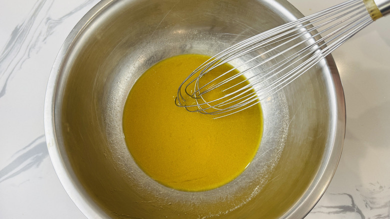 Red wine vinaigrette in a bowl with a whisk